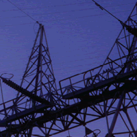 Electrical towers and wires against the blue sky