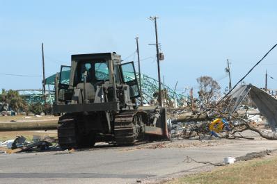 Gulfport, Miss., September 7, 2005 -- A member of the National Guard cleanups debris in Gulfport, Miss. Hurricane Katrina caused extensive damage all along the Mississippi gulf coast. FEMA/Mark Wolfe