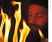 Christian Orthodox priest prays in Church of the Holy Sepulcher during ceremony of the Holy Fire in Jerusalem's Old City, 18 April 2009