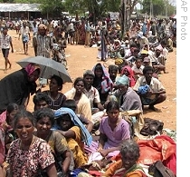Sri Lankan ethnic Tamil civilians wait for registration at a transit camp in Omantai, in Vavuniya,  north of Colombo, Sri Lanka, Wednesday, 22 April 2009