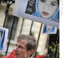 Members of media watchdog Reporters Without Borders demonstrate at the Iranian Embassy in Paris to call for the liberation of three journalists including reporter Roxana Saberi, 03 May 2009