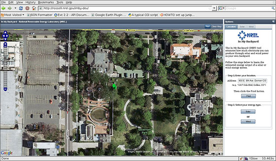 Image of a computer screen with an aerial photo of a parking lot on the left, several roofs and a park. To the right of that image is text in the In My Backyard software tool.