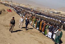 Afghan men stand and ready to offer prayers at the funeral of legislator Mustafa Kazimi in Kabul, Afghanistan on Nov. 8, 2007. AFP Photo.