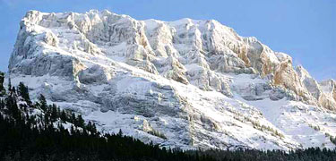 A dramatic snow-covered peak.