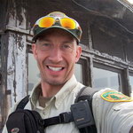 One of Mount Rainier's Volunteers in Parks (VIP) wearing VIP uniform and park radio.