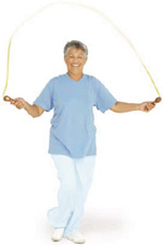 Photo of a woman exercising with a jump rope