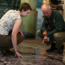 A ranger helping a vistor veiw the floor map at the Mississippi River Visitor Center.