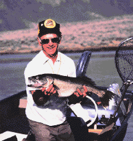 [photo of angler with a walleye he caught]