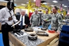 Richard Bratton, left, gives Secretary of Defense Robert M. Gates a tour of the Bradley transmission and 25-millimiter gun production facility at Red River Army Depot in Texarkana, Texas, May 2, 2008.