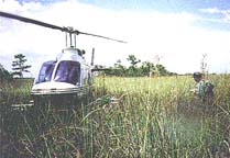 photo of helicopter and scientist