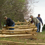 Volunteers help build historic fencing