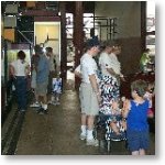 Visitors discover the History and Technology of railroad in Steamtown's museums.  Families view exhbits in an indoor dislplay area.