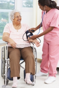 Health professional taking blood pressure