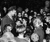 "Those two sticks of gum changed my life," recalled Retired U.S. Air Force Lt. Col. Gail S. Halvorsen later in his life about the first gifts he gave to Berlin children that gave him the idea for his parachute drops. This undated photo shows a young Halvorsen surrounded by a group of Berlin children trying to express their appreciation for the thousands of packages of gum and candy he and his friends dropped over Berlin in tiny hand-made parachutes. 