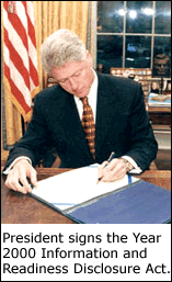 Photo of the President signing the Year 2000 Information and Readiness Disclosure Act