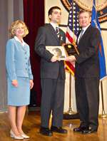 Photo of J. D'Alessandro accepting award on behalf of Rosemarie Louise D'Alessandro; he is accompanied by Deborah Daniels and John Ashcroft.