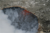 This near-vertical view reveals a vigorously bubbling lava surface below the rim of the vent within Halema`uma`u crater. Continuous spattering was casting globs of lava across the lake surface and onto the conduit walls.