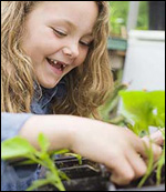 Photo: A girl container gardening