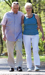 Photo of an elderly couple walking