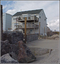 JRock bulkhead and Howarth's home in background. FEMA Photo