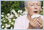 Woman Sneezing Outside