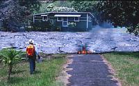 Lava approaches house in Kalapana, Kilauea Volcano, Hawai`i