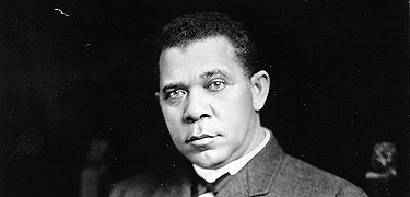 This is a photograph of Booker T. Washington posing in a chair.