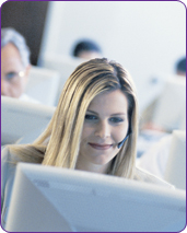 woman in a call center with a computer and a hands-free phone