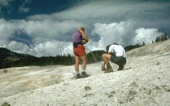 Photograph of scientists collecting gas samples at Washburn Hot Springs, Yellowstone National Park