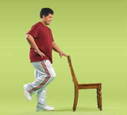 Photo of man doing stand on one foot exercise