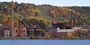 Autumn leaves provide a backdrop for the Quincy Smelting Works located along Portage Lake across from Houghton, Michigan.