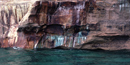 Mineral seepage creates the vibrant colors shown on this close-up photo of the Pictured Rocks cliffs.