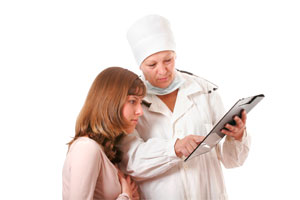 Doctor showing papers to a patient