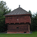 Two-story Fort Kent blockhouse constructed of square-hewn cedar logs.