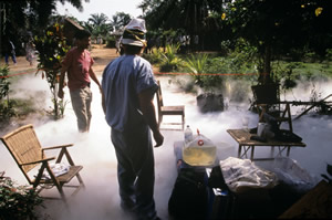 Khan on site in Zaire during monkeypox outbreak, surrounded by liquid nitrogen.