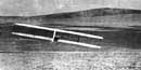 The glider with Big Kill Devil Hill in 1902