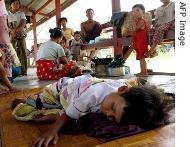 Families take refuge in a school building after losing their homes to Cyclone Nargis, Hlaing Thayar Township, Rangoon, 08 May 2008