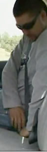 man adjusting seatbelt