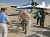 Retiring Center Director Kevin L. Petersen is splashed with buckets of water by Dryden employees following his final flight in the F/A-18.