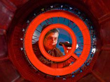 Henry Hernandez inspects the afterburner section of a GE F-404 engine.