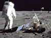 astronaut and lunar lander on moon