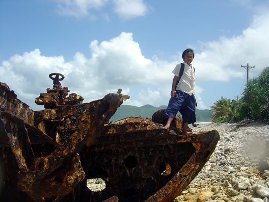 Vessel debris field on Aunuu, American Samoa - children playing on debris