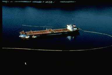 Aerial view of the Exxon Valdez surrounded by boom