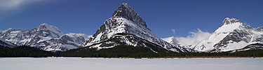 Many Glacier and frozen Swiftcurrent Lake
