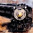 A steam locomotive leans into a curve on a Steamtown Excursion.