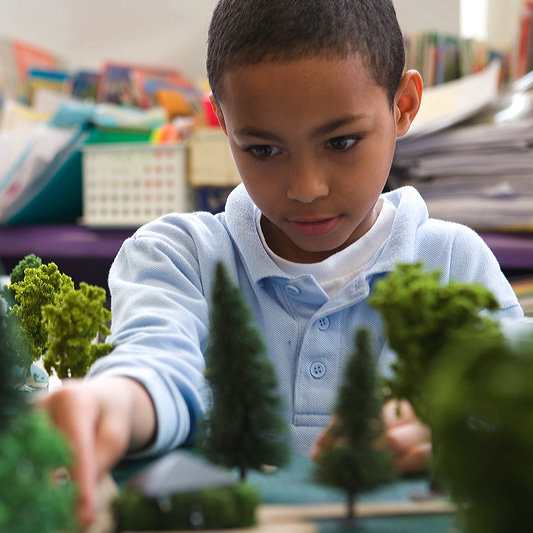 A student at Boston's O'Hearn Elementary School, designs a park as part of the Good Neighbors program