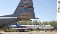 Undated file photo shows Kyrgyz passenger jet Tu-154 (background) and US military aircraft at  airfield of Manas airport 