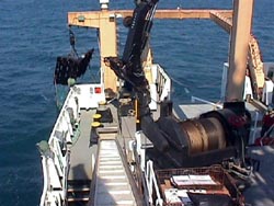 The trawling gear is set up on the starboard side of the fantail.