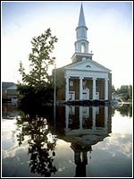 Photo of a church submerged in water.