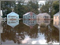 Photo of houses submerged in flood waters.